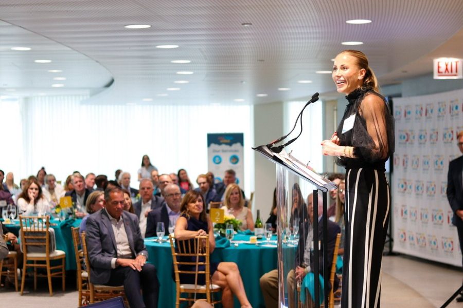 Courtney Shondel today, smiling as she speaks at a One Hope United event